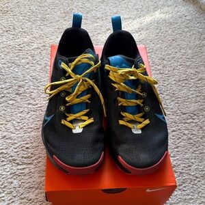 Nike Athletic Shoes with Blue Accents and Yellow Laces
